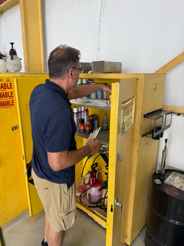 Checking supplies in a flammables cabinet
